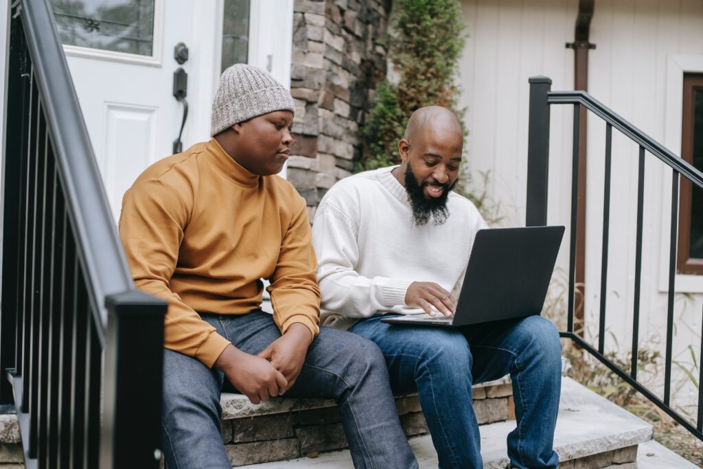 Men searching on laptop